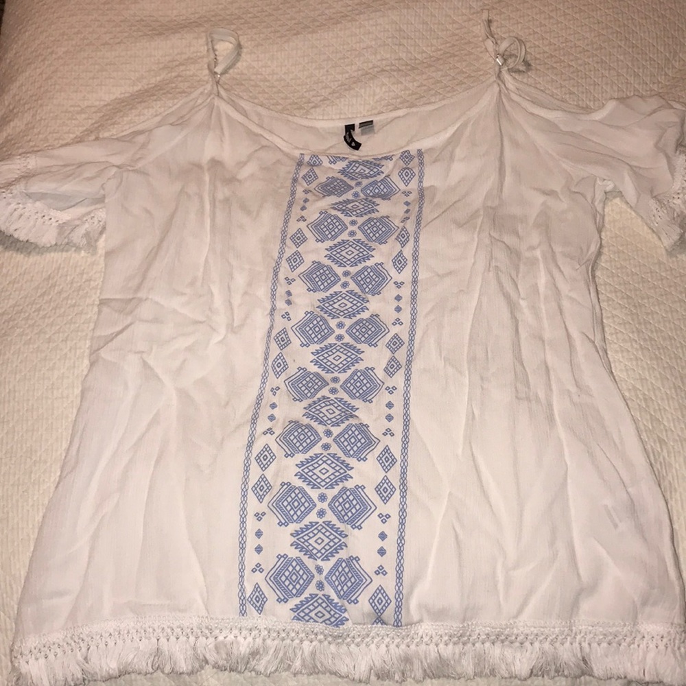 Cold shoulder fringe shirt